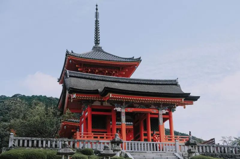 A traditional red temple and pagoda in Kyoto, Japan