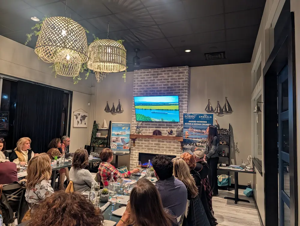 Travel Club guests at a featured-destination presentation