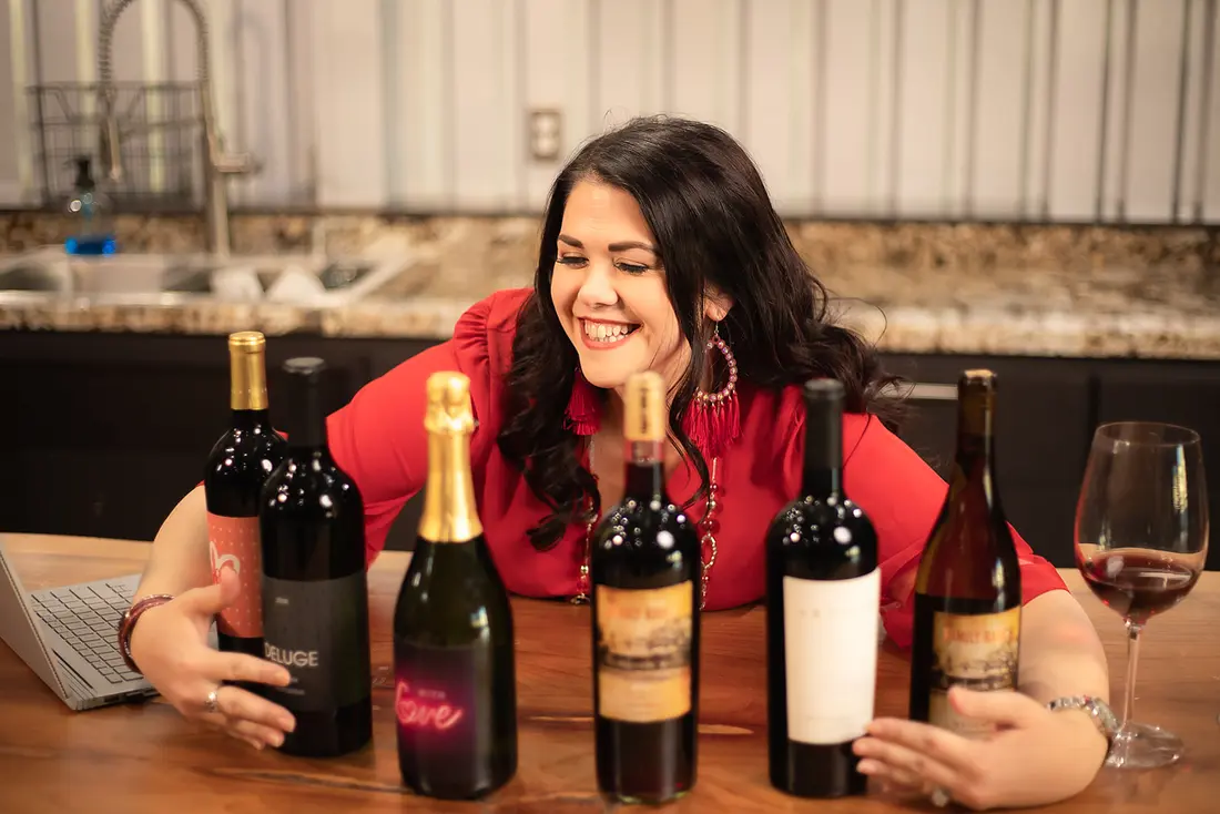 Lindsey with a lineup of wines on her Vino Vacay program