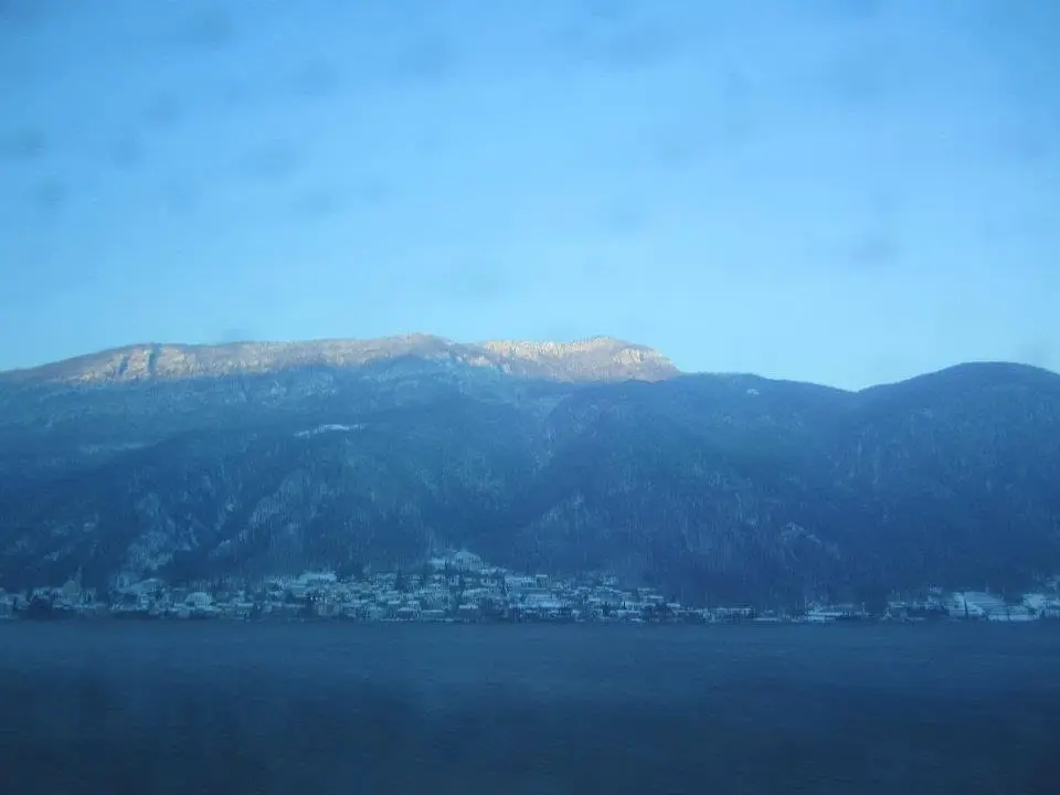 Snow-capped Swiss Alps above an alpine lake