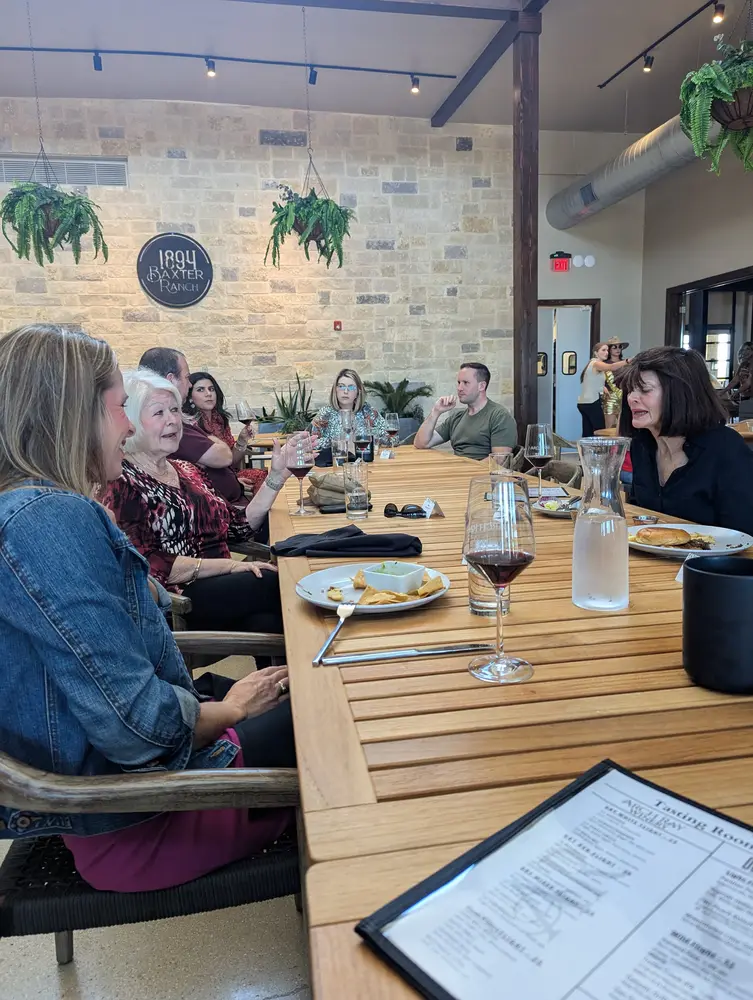 Travelers at a wine tasting in the Texas Hill Country